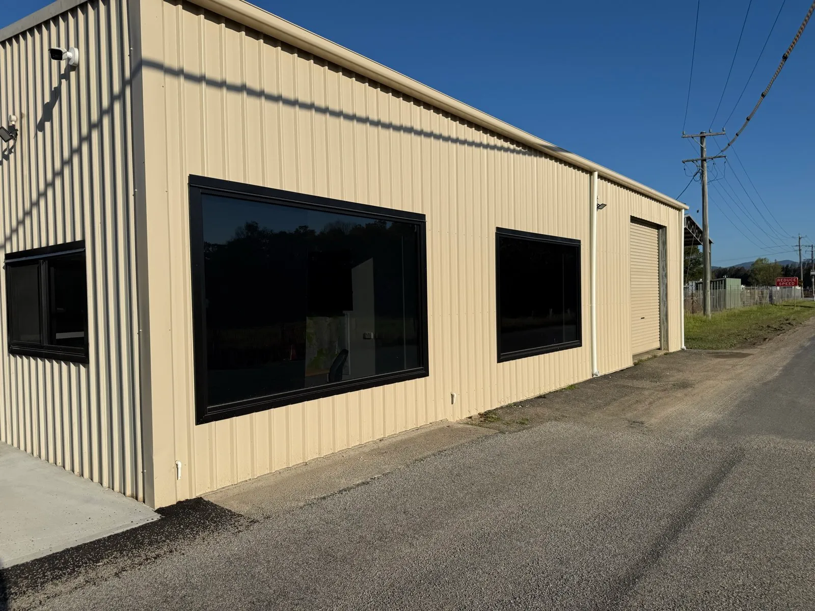 New Colorbond cladding with double glazed tinted windows and a roller door at the works depot office, Macksville